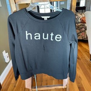 Banana Republic black sweatshirt that says “haute.”